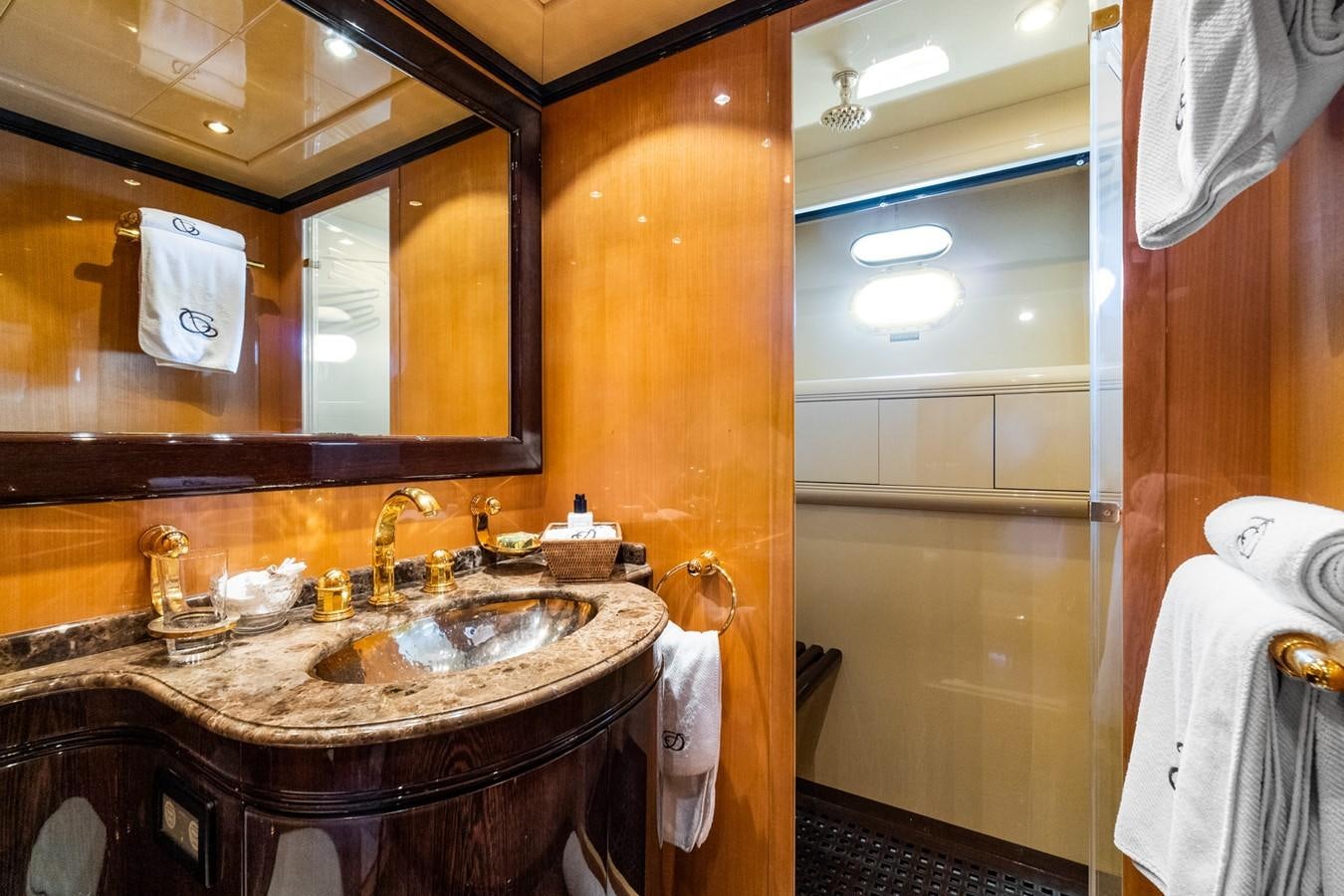 a bathroom with a large mirror aboard KUY KUY Yacht for Sale