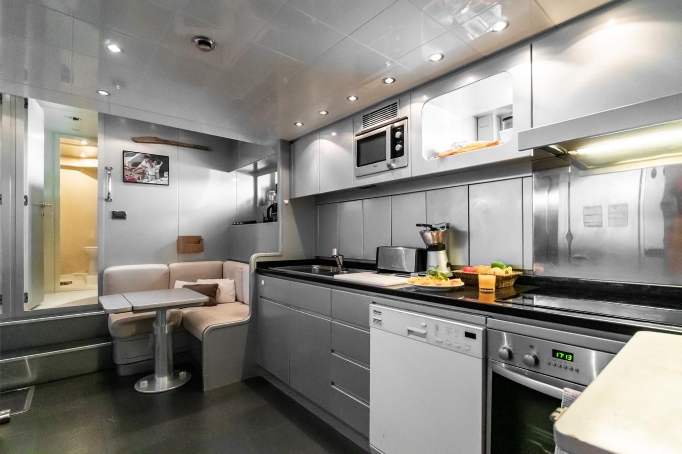 a kitchen with a stove and oven aboard KUY KUY Yacht for Sale