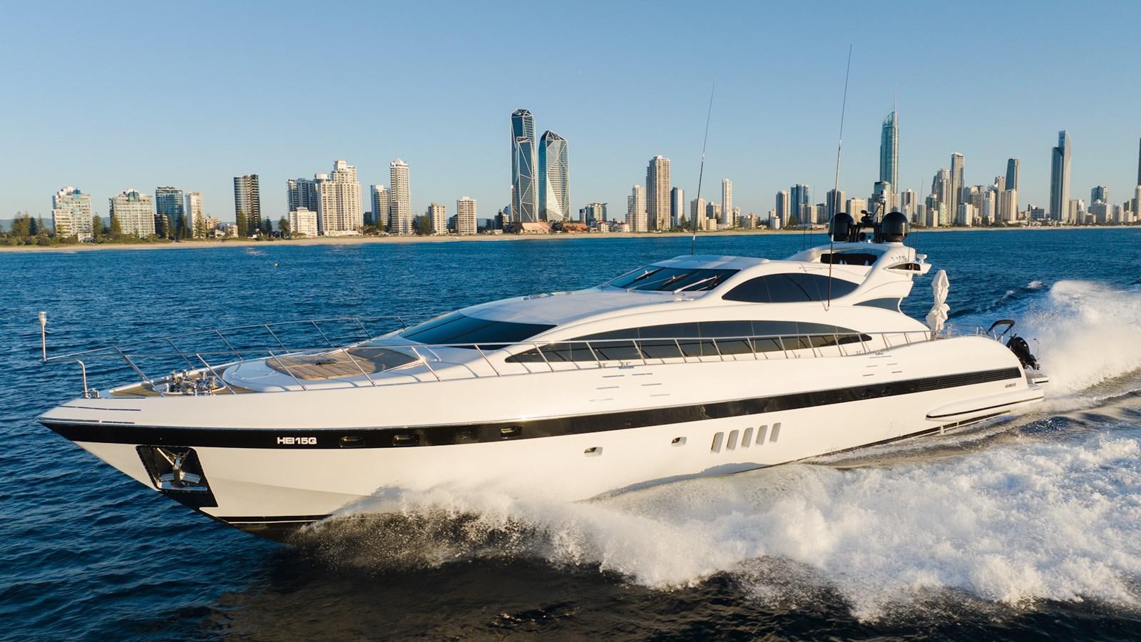 a white yacht on the water aboard HELLS BELLS Yacht for Sale