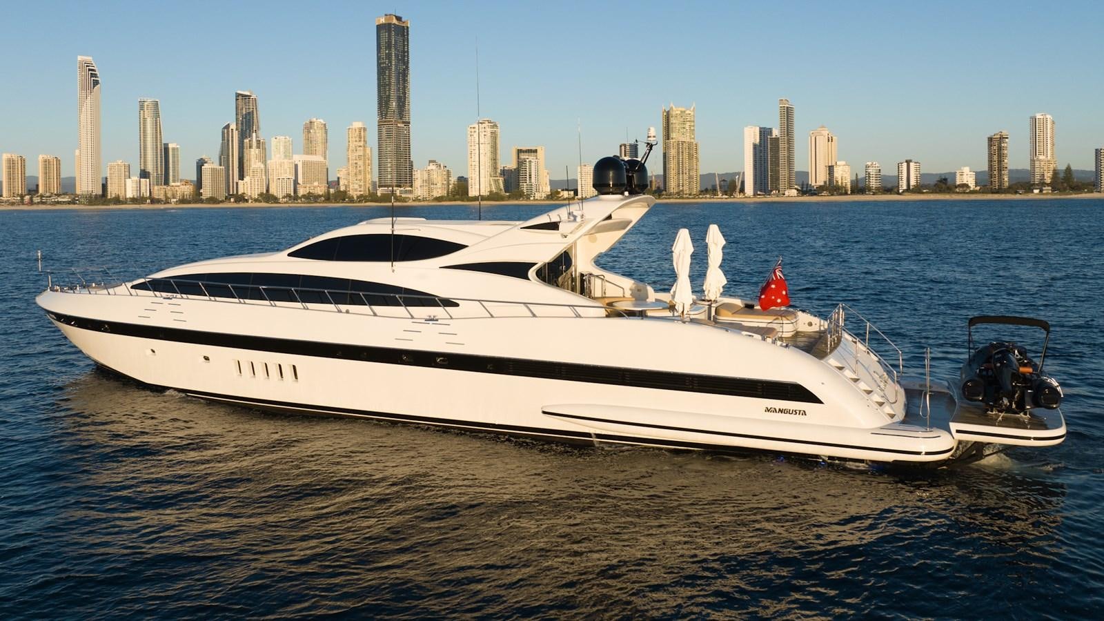a white yacht on the water aboard HELLS BELLS Yacht for Sale