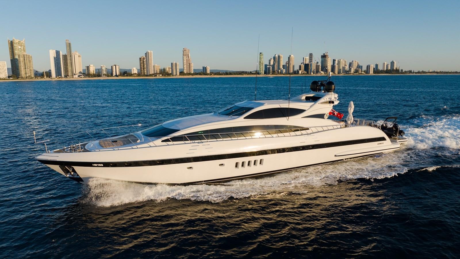 a white yacht on the water aboard HELLS BELLS Yacht for Sale