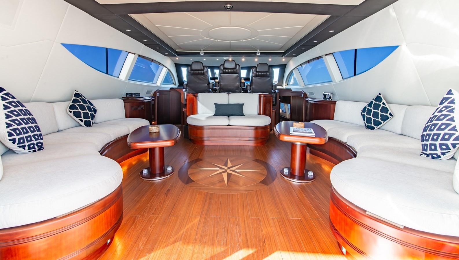 a room with a couch and a table aboard HELLS BELLS Yacht for Sale