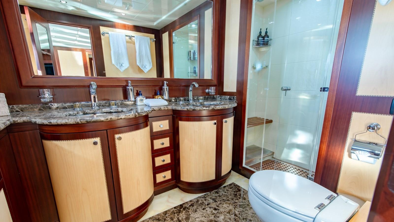 a bathroom with a sink and a shower aboard HELLS BELLS Yacht for Sale