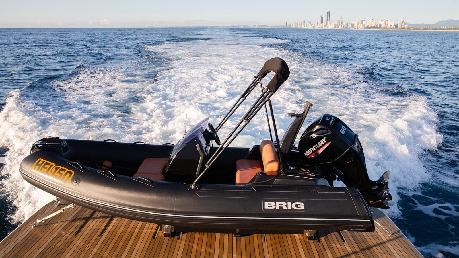 a speed boat on the water aboard HELLS BELLS Yacht for Sale