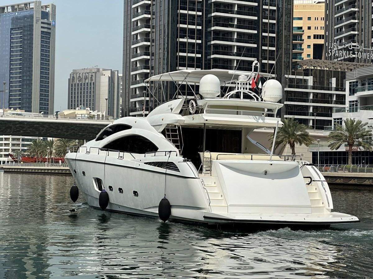 a white boat in the water aboard MANIA Yacht for Sale