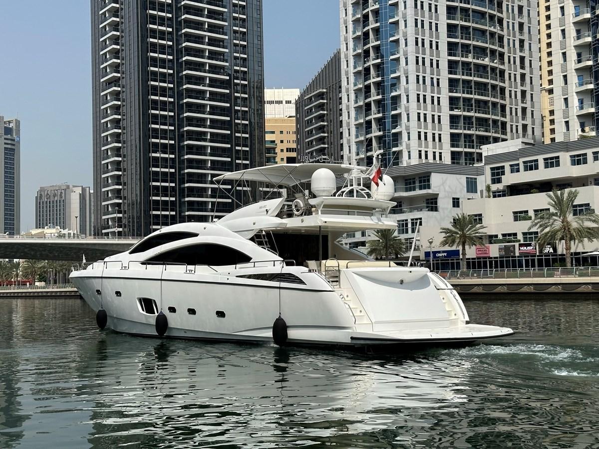 a white boat in the water aboard MANIA Yacht for Sale