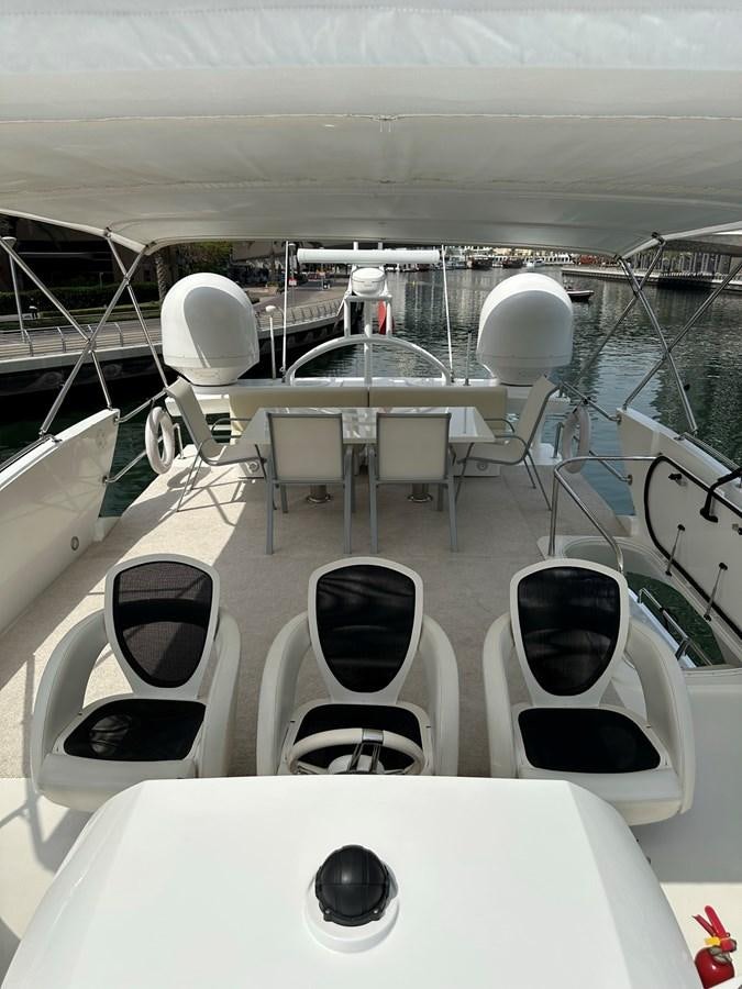 a room with chairs and tables aboard MANIA Yacht for Sale