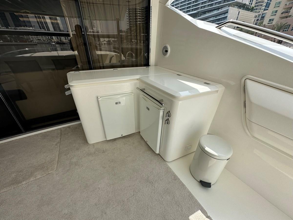 a bathroom with a sink and a trash can aboard MANIA Yacht for Sale