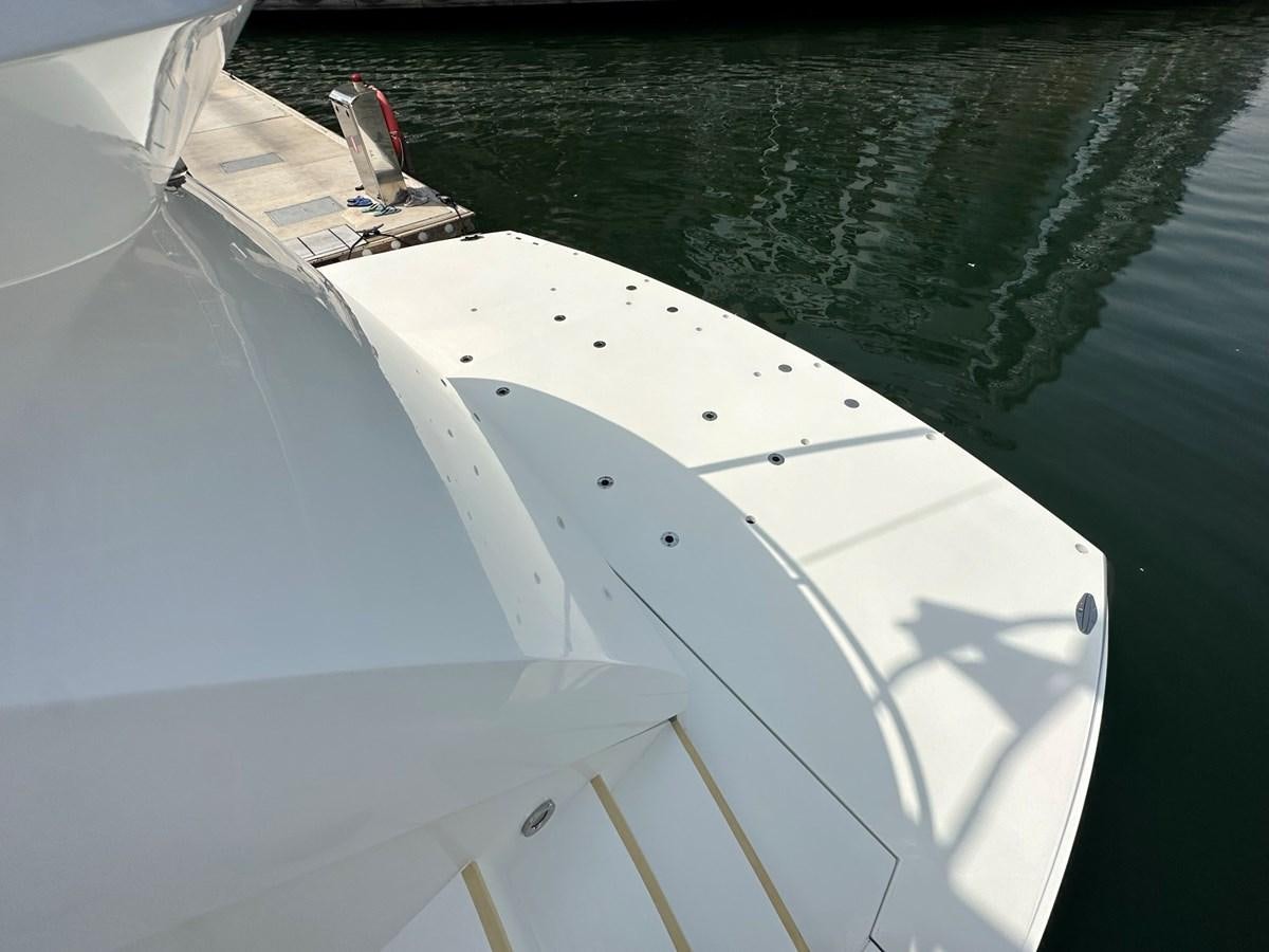 a white boat in the water aboard MANIA Yacht for Sale