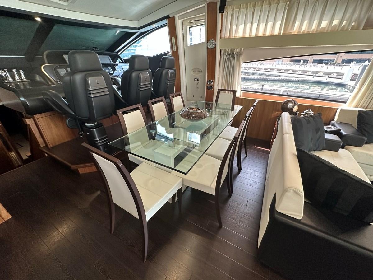 a train with a table and chairs aboard MANIA Yacht for Sale