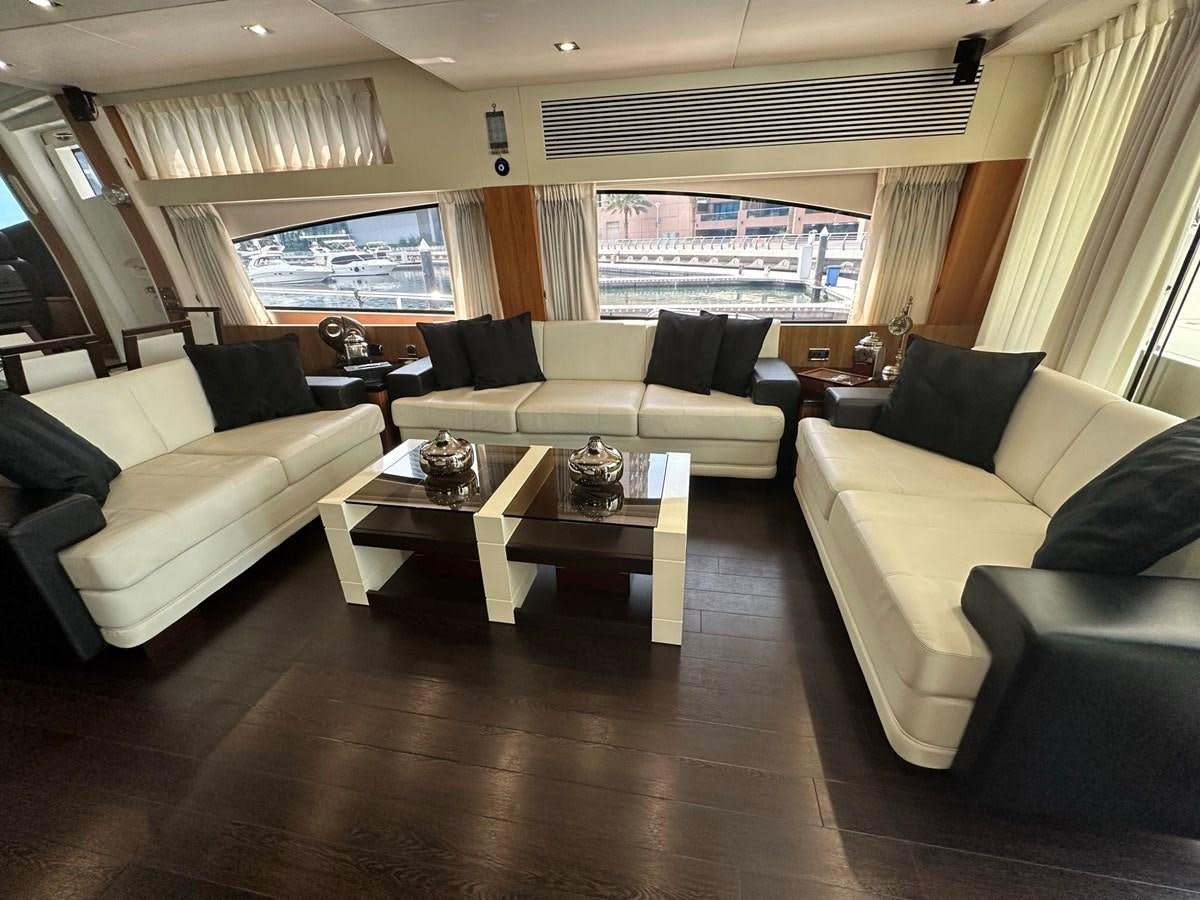 a living room with a wood floor aboard MANIA Yacht for Sale