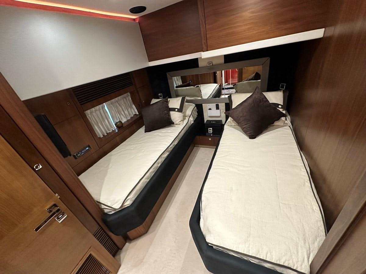 a room with a bed and a desk aboard MANIA Yacht for Sale