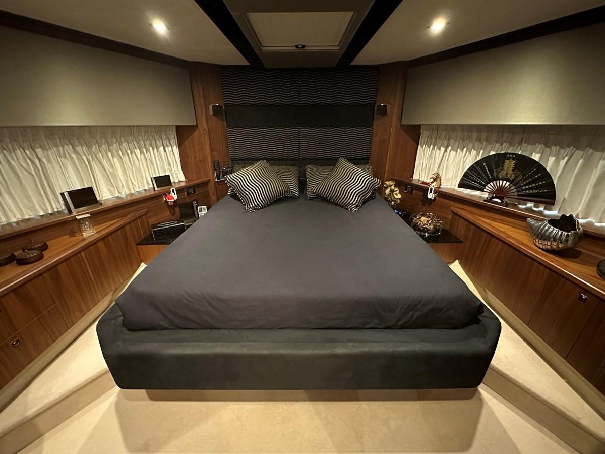 a bed in a room aboard MANIA Yacht for Sale
