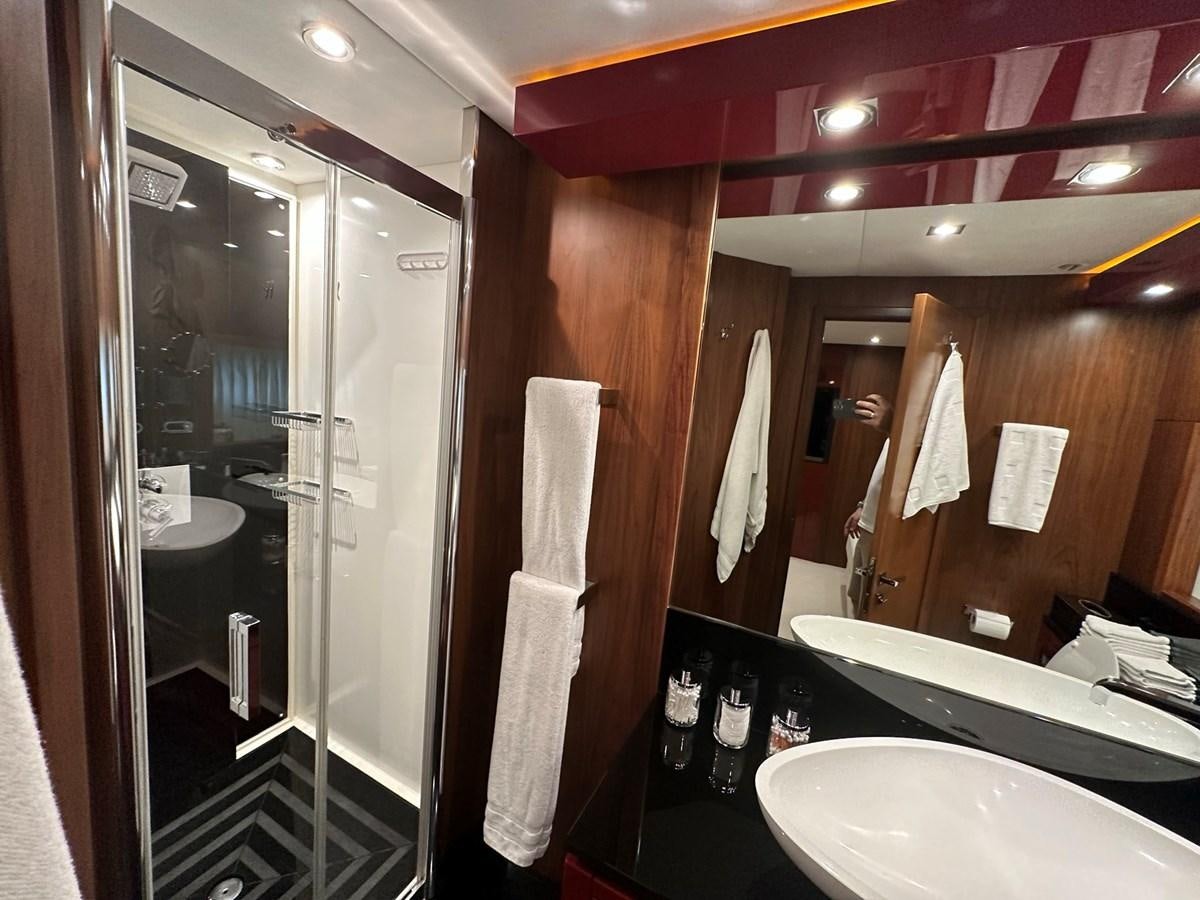 a bathroom with a glass shower aboard MANIA Yacht for Sale