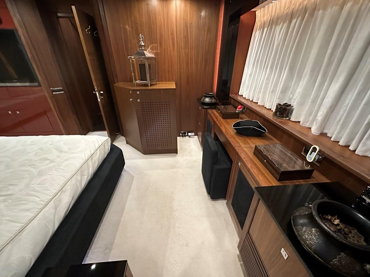a bedroom with a bed and a sink aboard MANIA Yacht for Sale