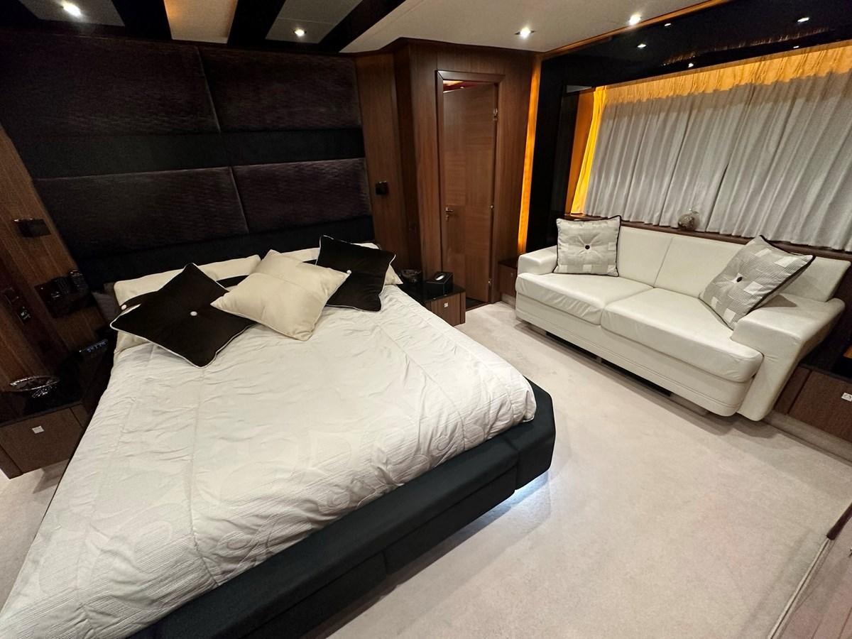 a room with a bed and a couch aboard MANIA Yacht for Sale
