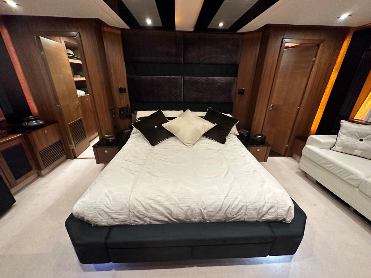 a room with a bed and a desk aboard MANIA Yacht for Sale