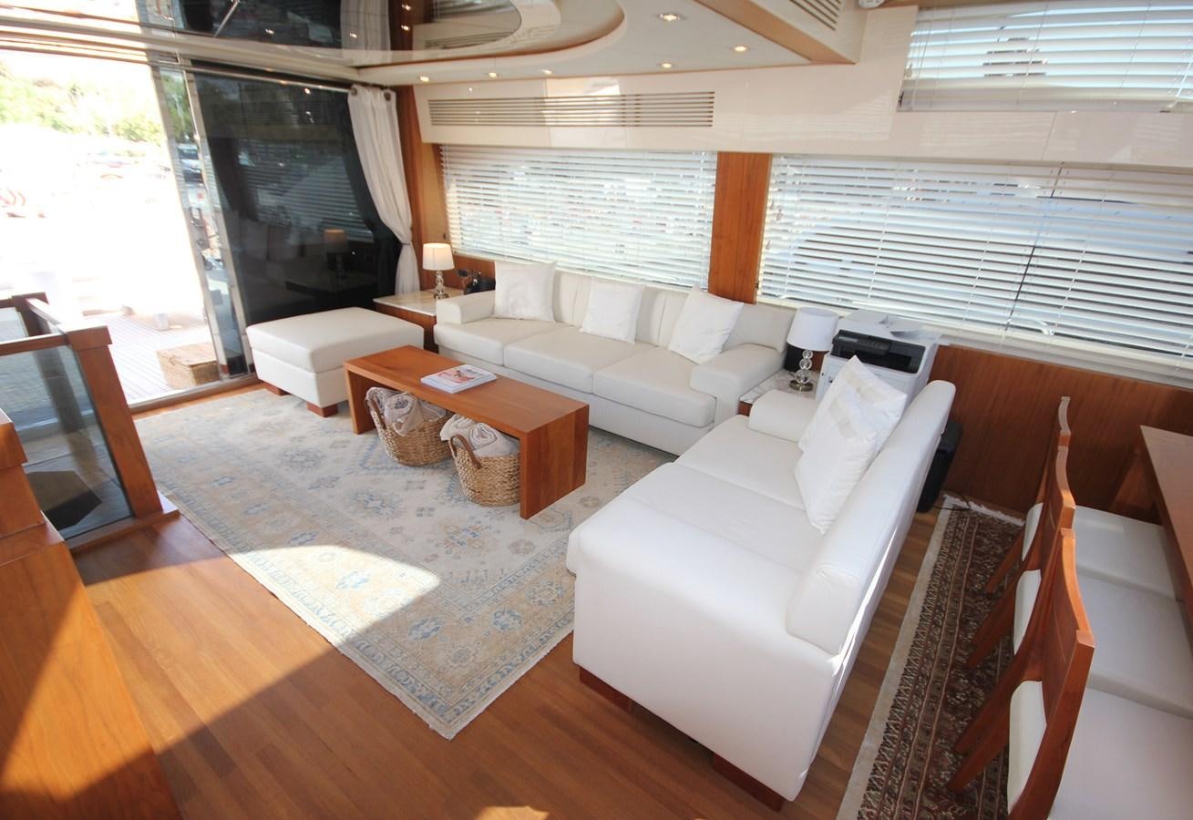 a living room with a large window aboard COPPER 3 Yacht for Sale