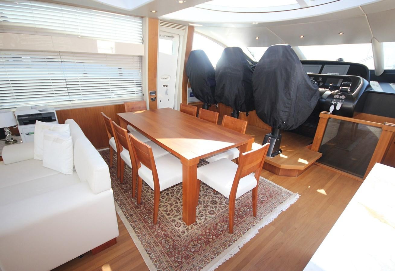 a room with a table and chairs aboard COPPER 3 Yacht for Sale