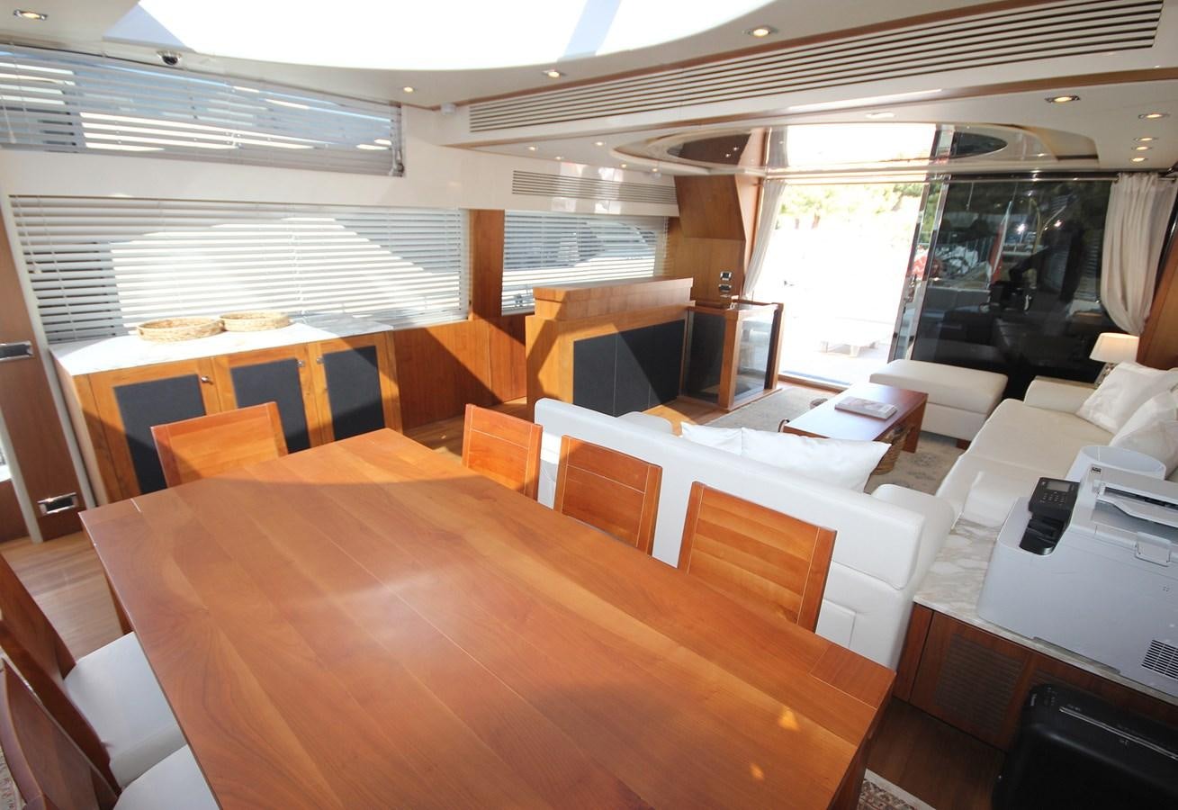 a room with tables and chairs aboard COPPER 3 Yacht for Sale