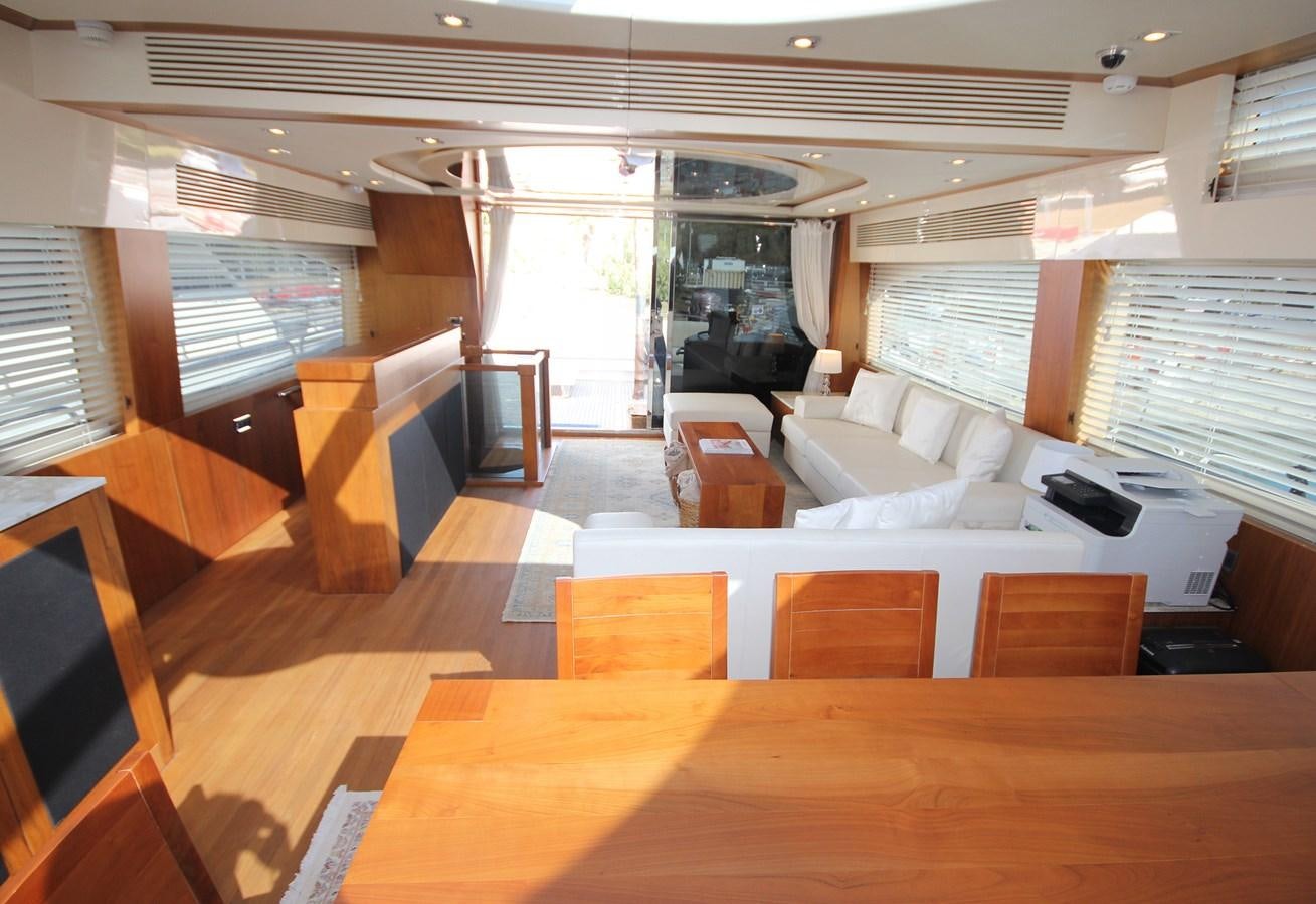 a room with a couch and a table aboard COPPER 3 Yacht for Sale