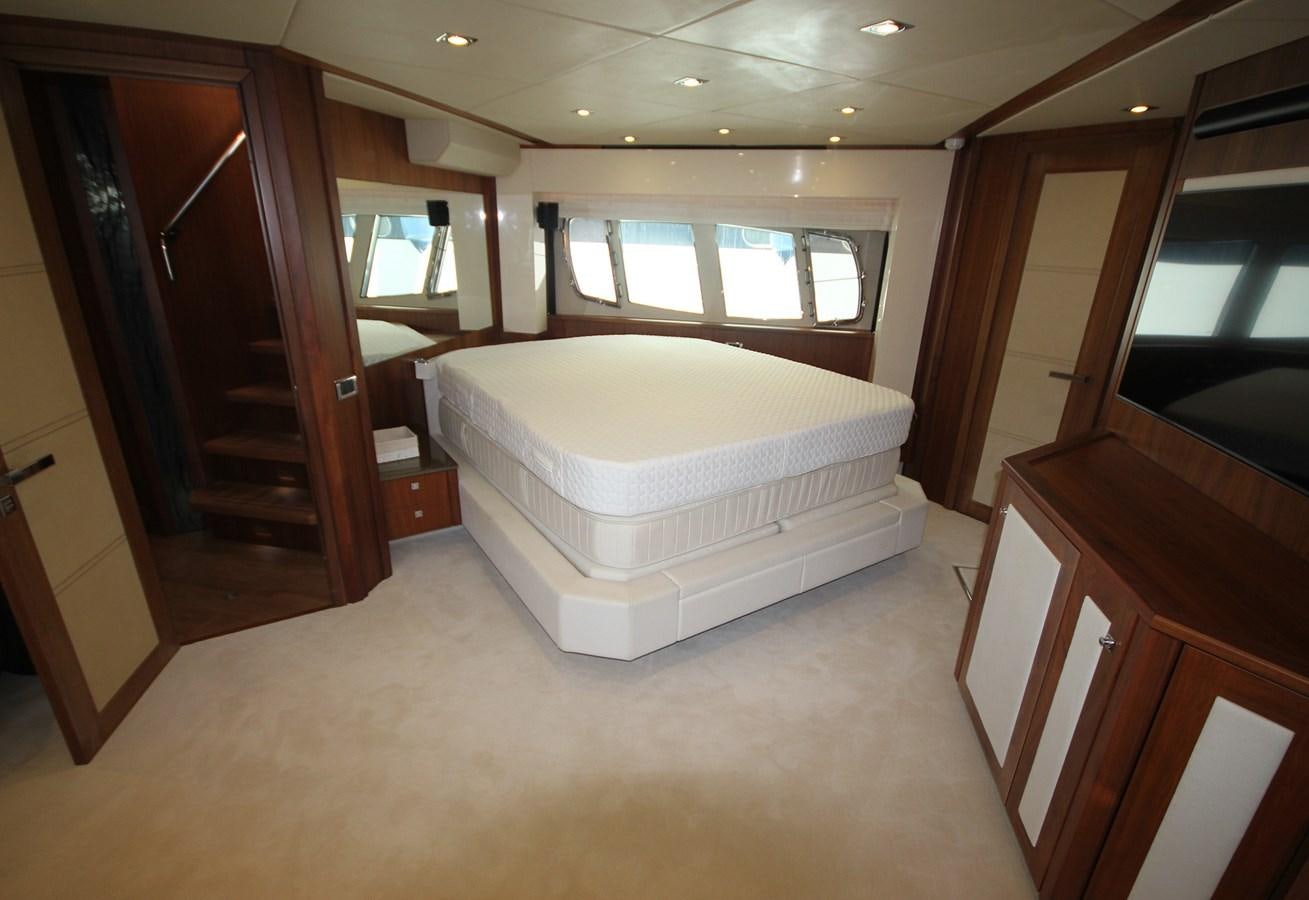 a bedroom with a bed and a closet aboard COPPER 3 Yacht for Sale