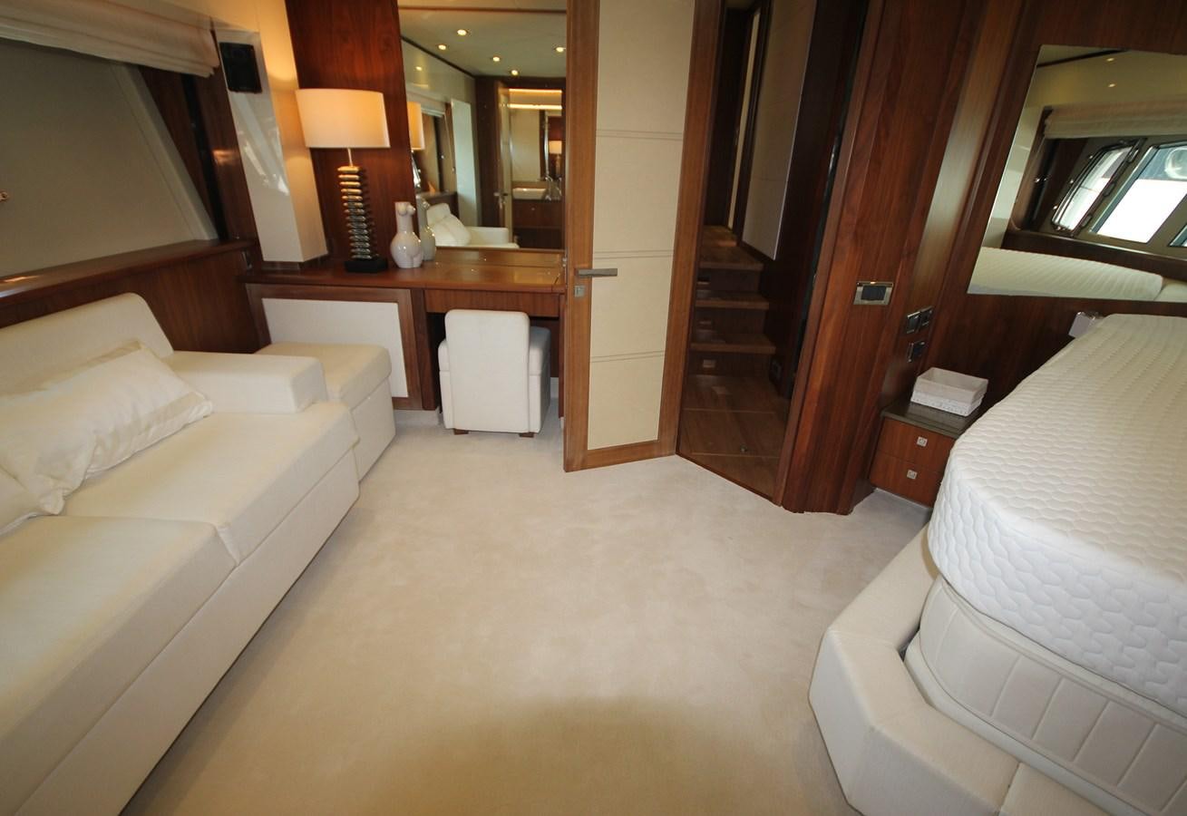 a room with a bed and a desk aboard COPPER 3 Yacht for Sale