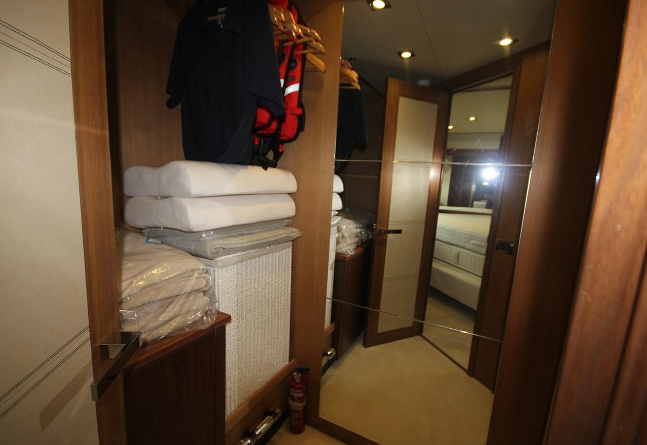 a bathroom with a closet and a bed aboard COPPER 3 Yacht for Sale