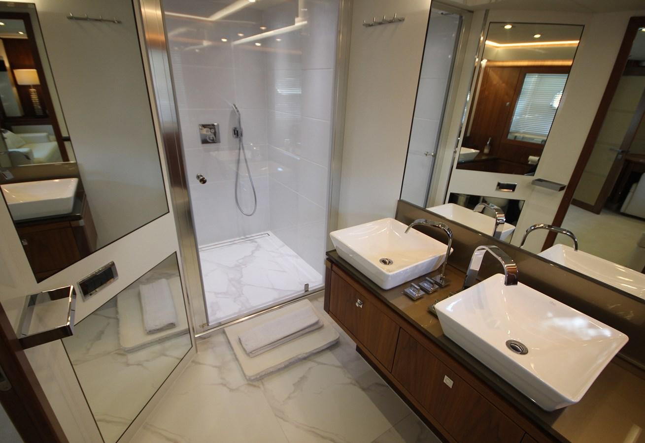 a bathroom with a sink and a shower aboard COPPER 3 Yacht for Sale
