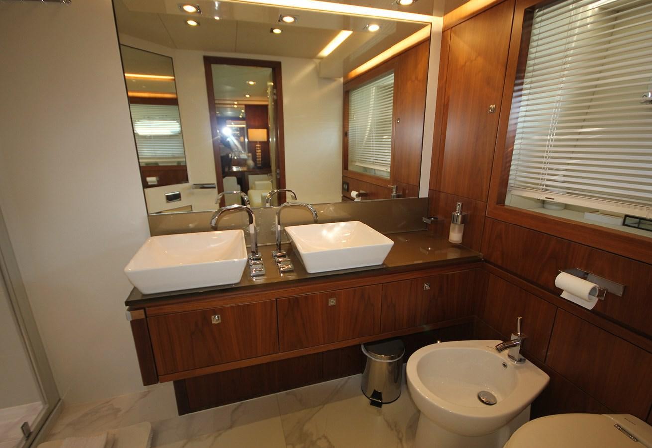 a bathroom with a large mirror aboard COPPER 3 Yacht for Sale