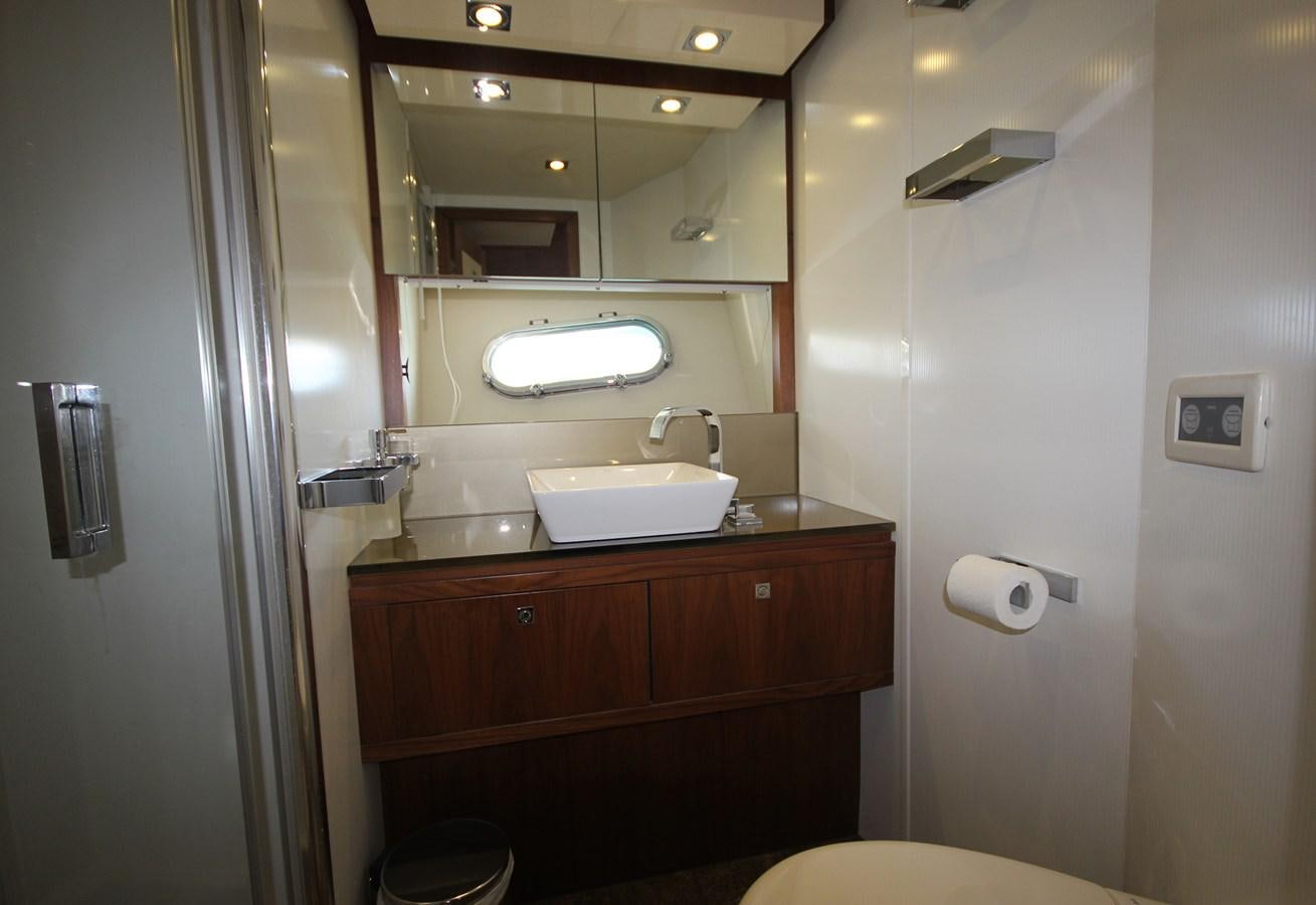 a bathroom with a sink and a mirror aboard COPPER 3 Yacht for Sale