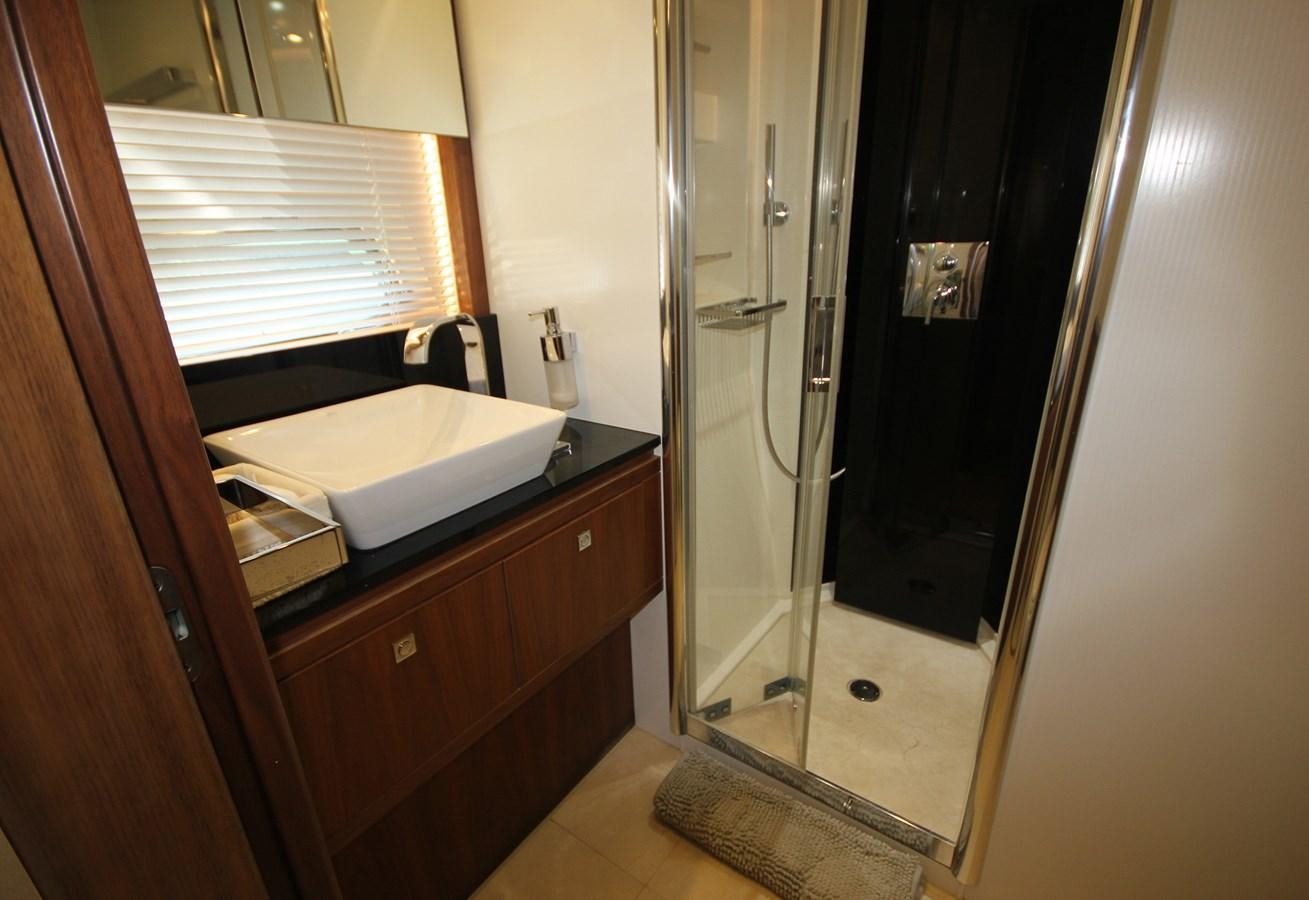 a bathroom with a shower unit and sink aboard COPPER 3 Yacht for Sale