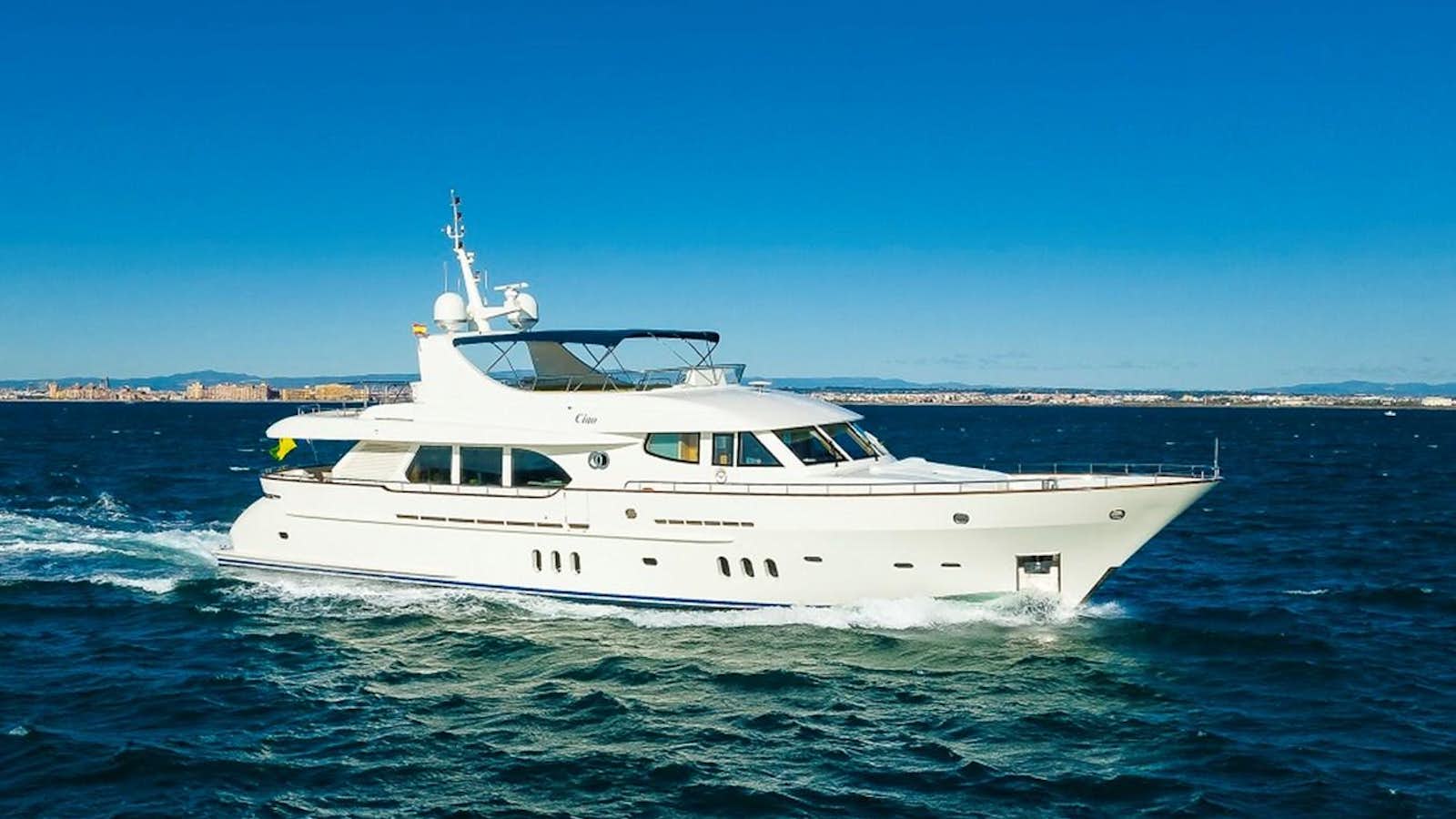 a white boat on the water aboard CIAO Yacht for Sale