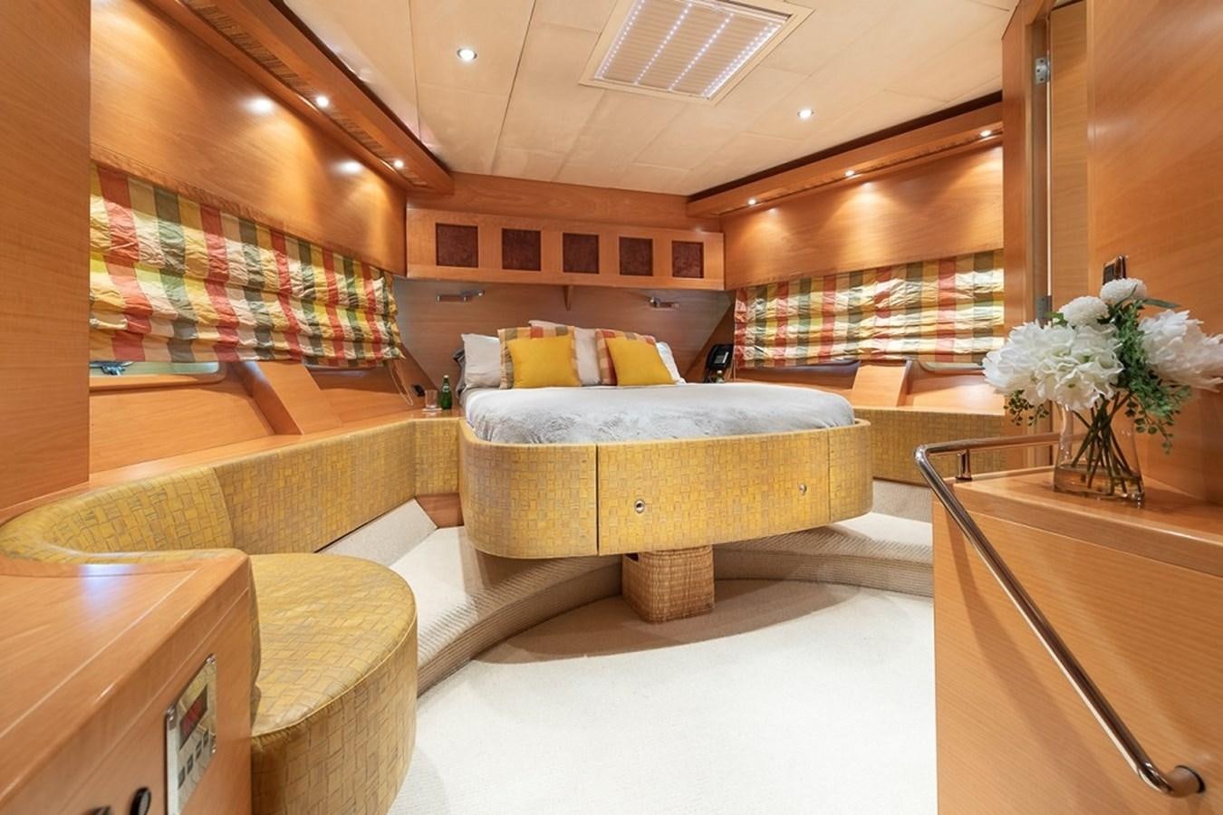 a room with a couch and a table aboard CIAO Yacht for Sale