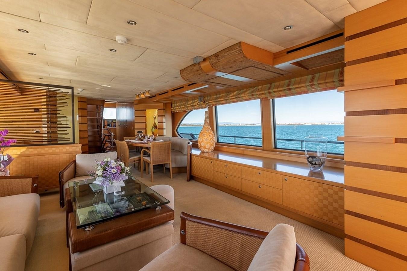 a living room with a large window aboard CIAO Yacht for Sale