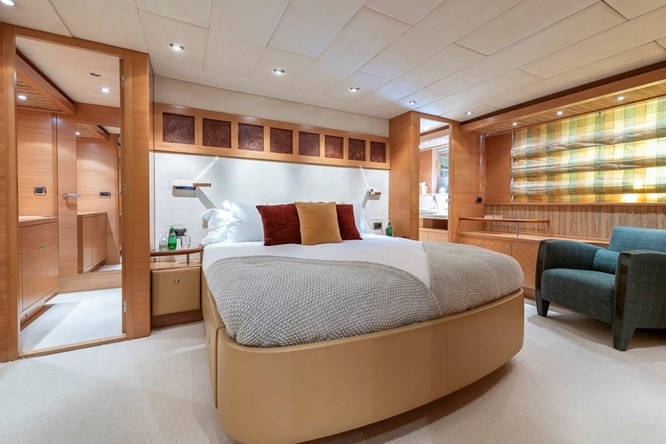 a bed in a room aboard CIAO Yacht for Sale