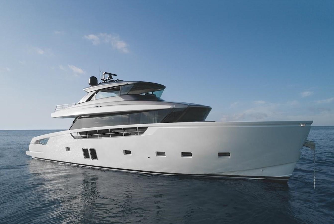 a white yacht in the water aboard EB Yacht for Sale