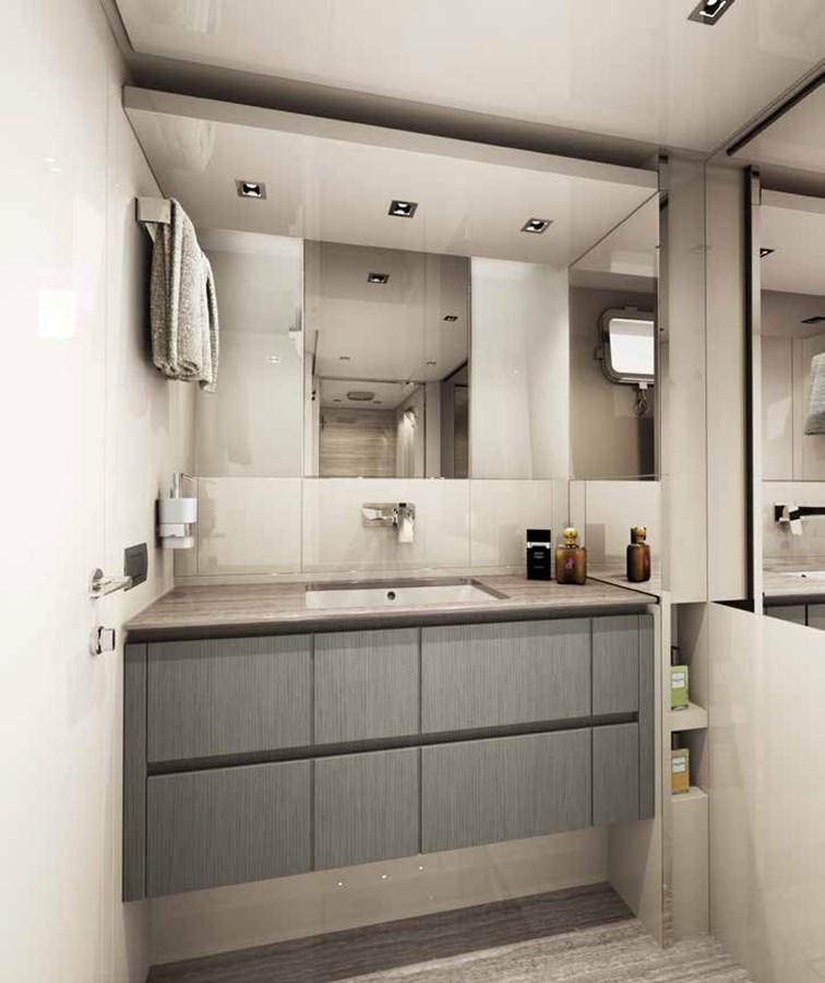 a bathroom with a sink and a mirror aboard EB Yacht for Sale