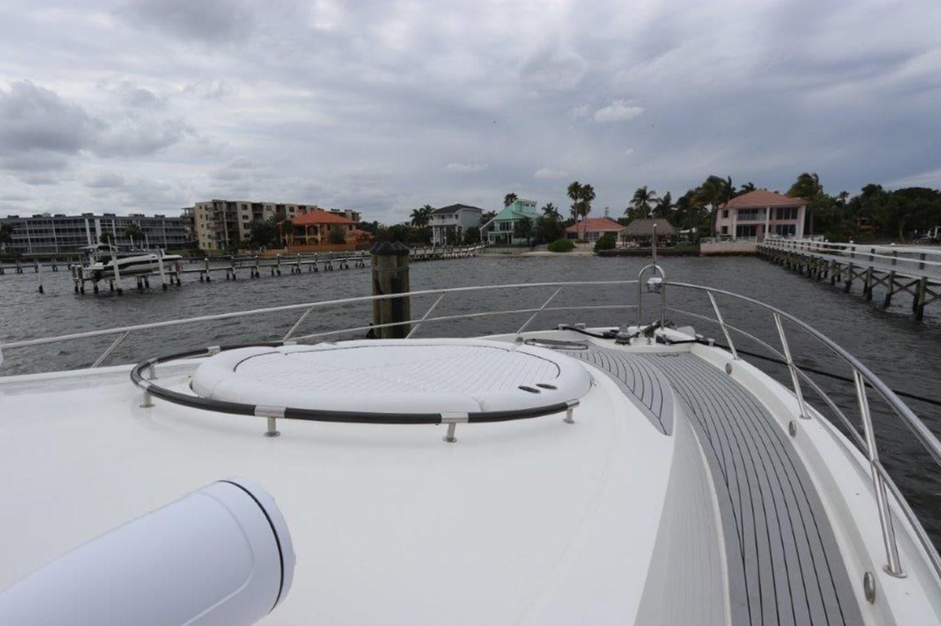 a large white roof with a building in the background aboard BG Yacht for Sale