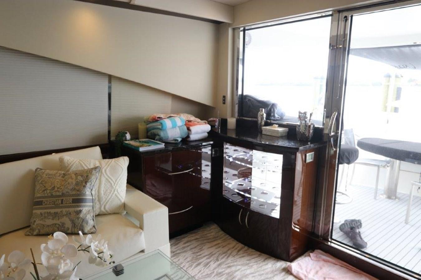 a living room with a glass door aboard BG Yacht for Sale