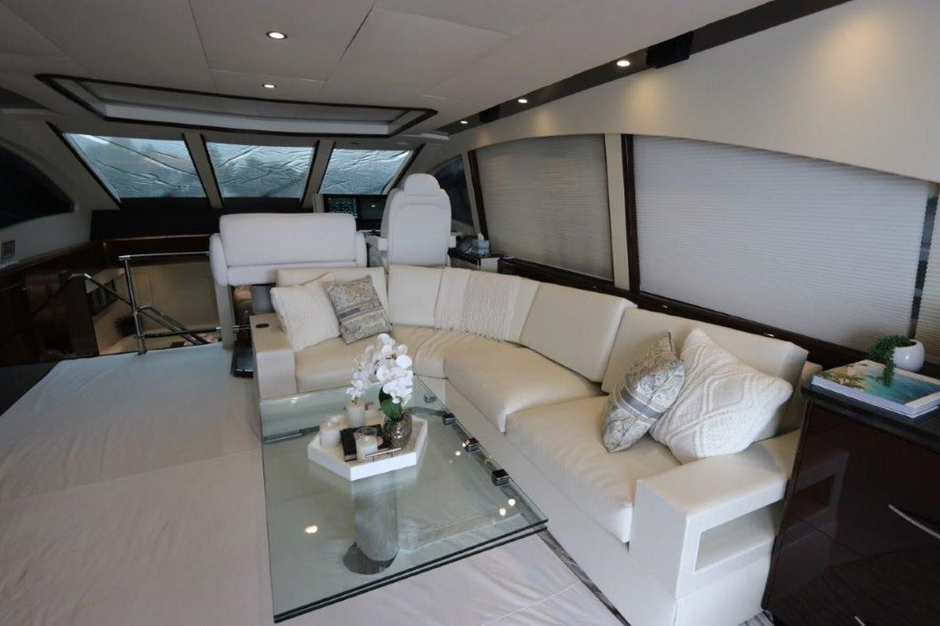a living room with a couch and a coffee table aboard BG Yacht for Sale
