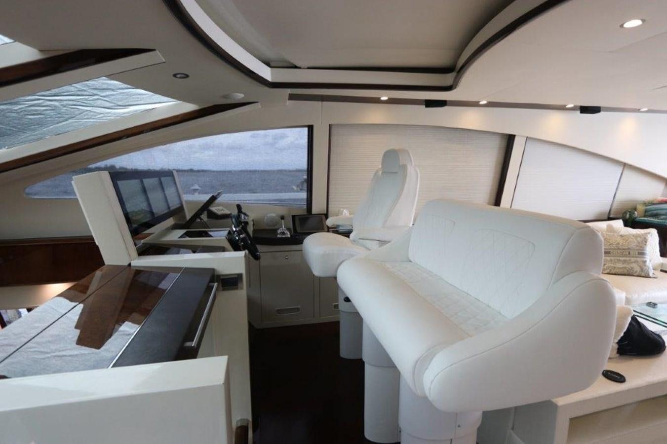 a room with a desk and chairs aboard BG Yacht for Sale