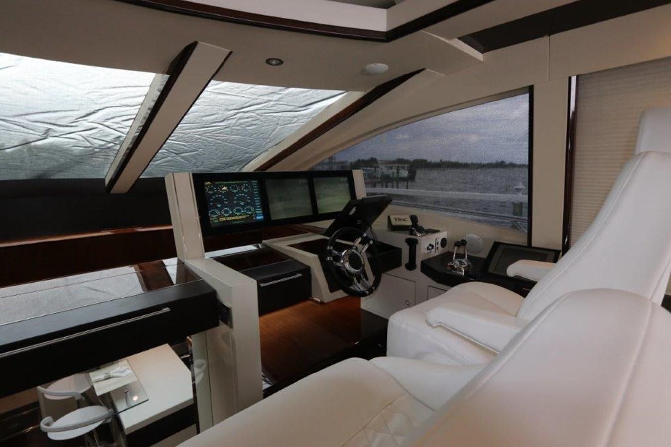 a room with a large window and a desk with a computer and a large window aboard BG Yacht for Sale