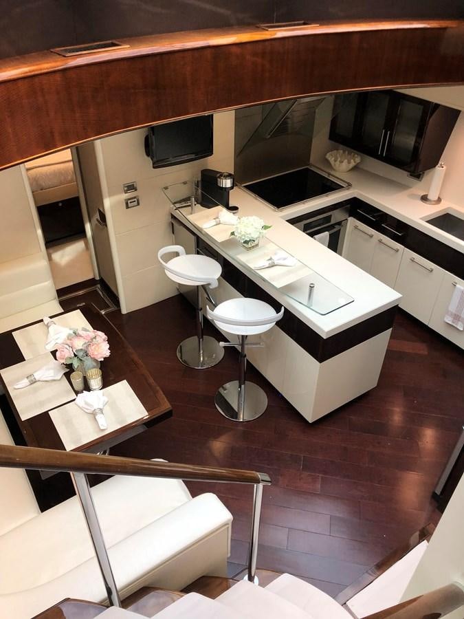 a kitchen with a table and chairs aboard BG Yacht for Sale