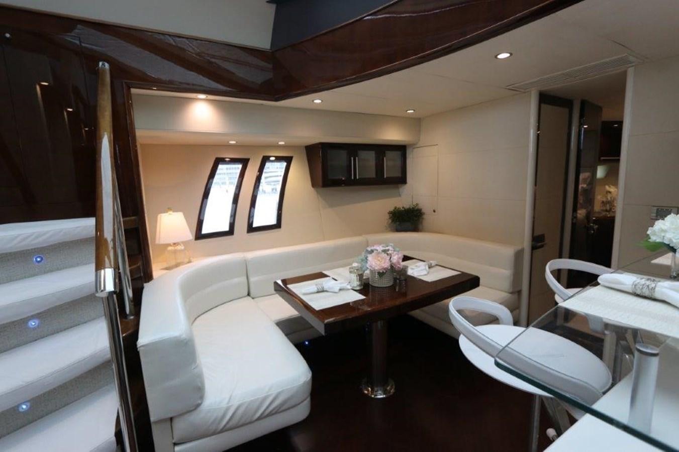 a room with a bed and a table aboard BG Yacht for Sale