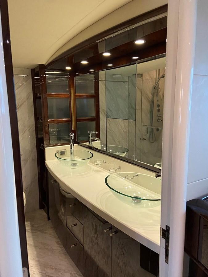 a bathroom with a large mirror aboard BG Yacht for Sale