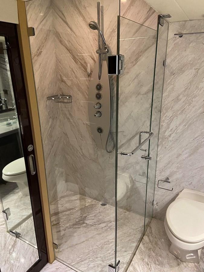 a shower with a glass door aboard BG Yacht for Sale