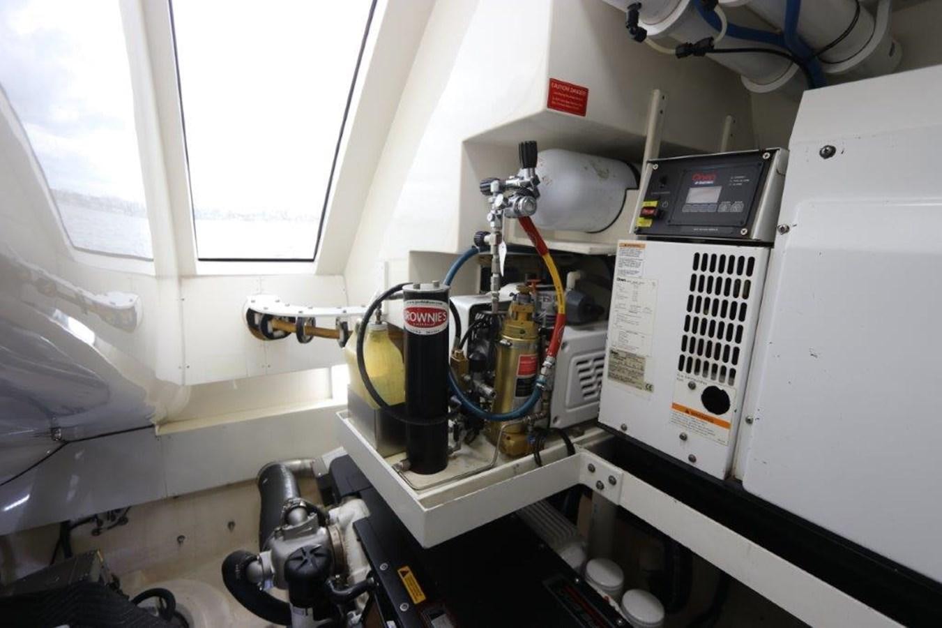 a machine with a large piece of equipment in it aboard BG Yacht for Sale