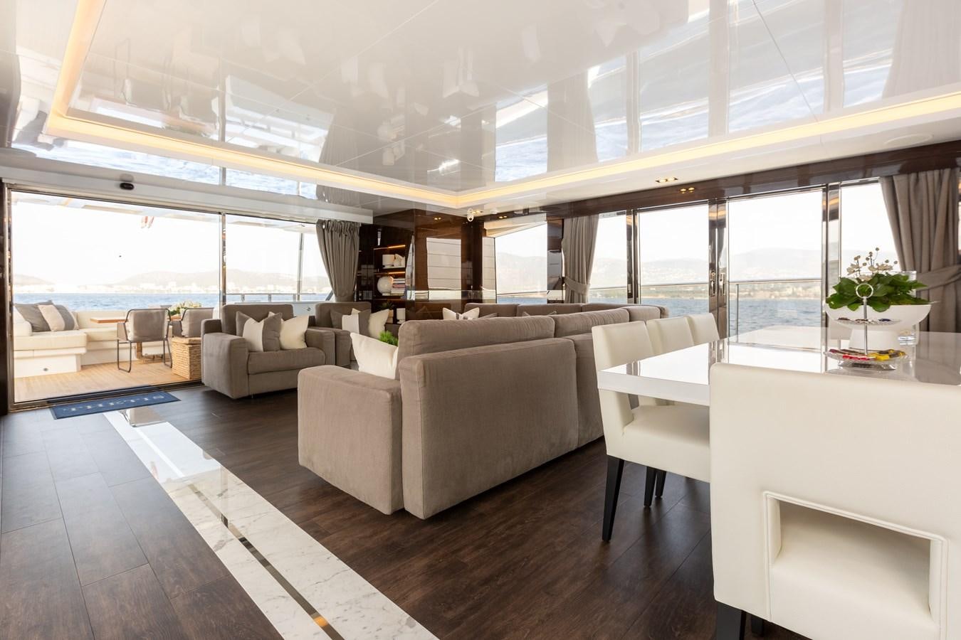 a room with couches and a table aboard THETIS Yacht for Sale