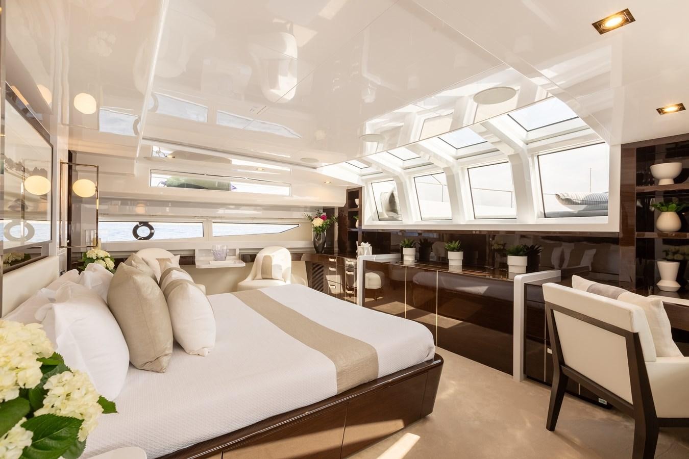 a room with a bed and a table aboard THETIS Yacht for Sale